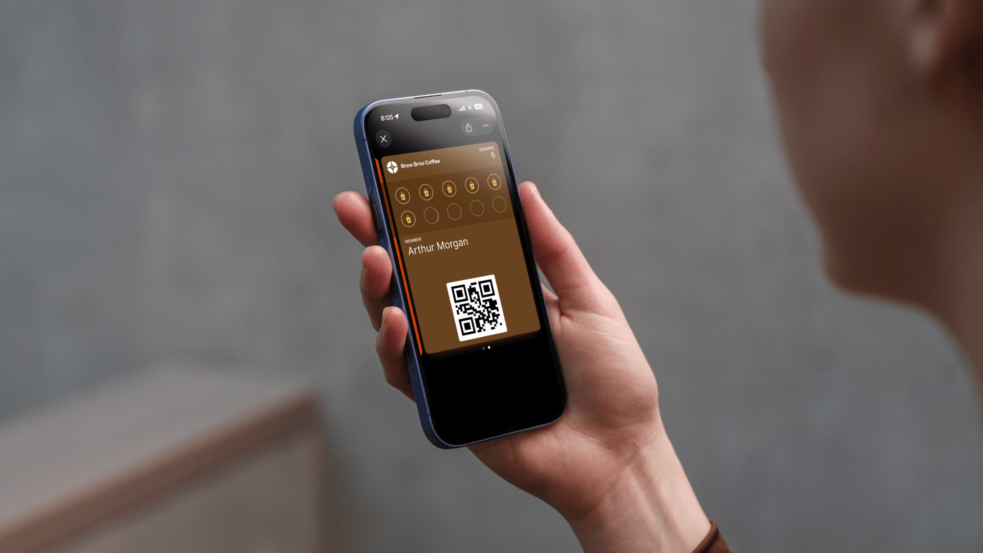 A customer's Apple Wallet showing a Stamperly loyalty card with 6 out of 10 stamps collected. The card shows the business logo, stamp progress, and reward info.